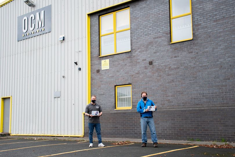 Staff stood outside OCM HQ