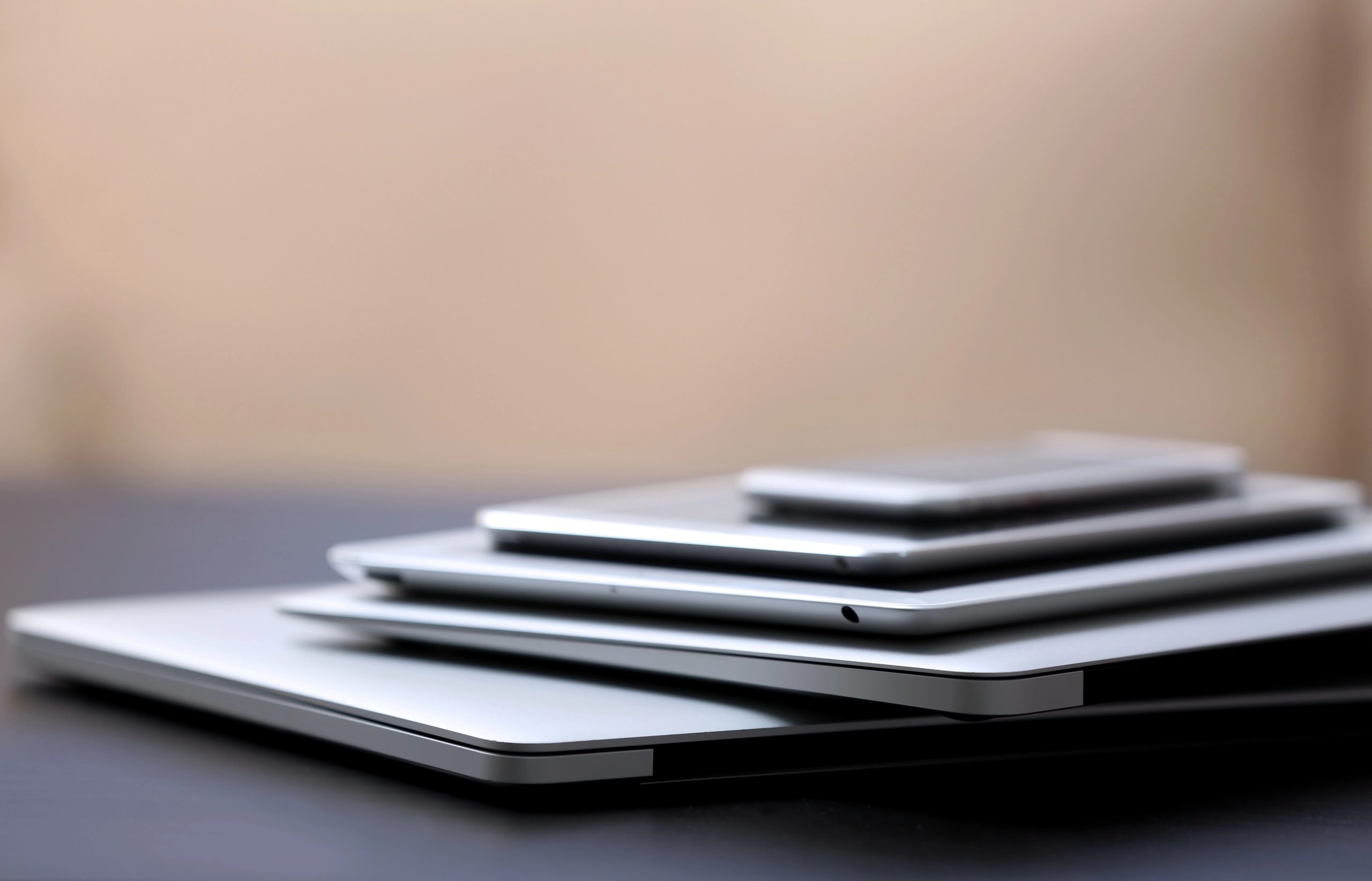 Stack of refurbished business laptops ready for donation to a charity or school